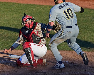 NILES, OHIO - APRIl 3, 2019: Youngstown State's Dylan Swarmer, left, tags out Kent State's Kian O'Brien during the fifth inning of their game, Wednesday evening at Eastwood Field. Youngstown State won 4-3 in eleven innings. DAVID DERMER | THE VINDICATOR