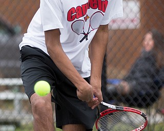 Canfield junior Sirin Nalluri hits the ball during a match against Howland at Canfield High School on Thursday. EMILY MATTHEWS | THE VINDICATOR