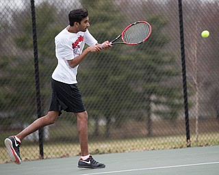 Canfield junior Sirin Nalluri hits the ball during a match against Howland at Canfield High School on Thursday. EMILY MATTHEWS | THE VINDICATOR