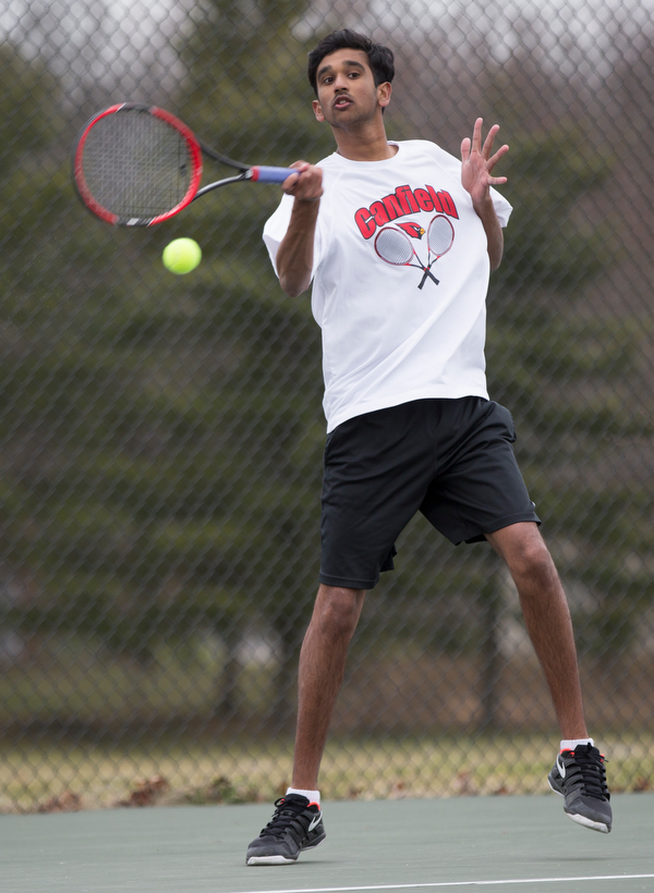 Canfield junior Sirin Nalluri hits the ball during a match against Howland at Canfield High School on Thursday. EMILY MATTHEWS | THE VINDICATOR