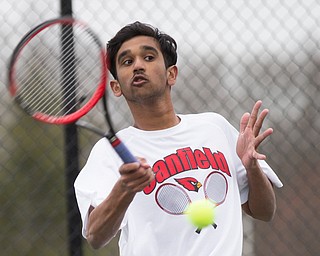 Canfield junior Sirin Nalluri hits the ball during a match against Howland at Canfield High School on Thursday. EMILY MATTHEWS | THE VINDICATOR