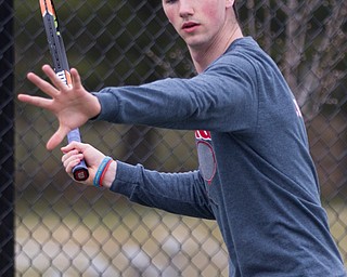 Canfield senior Noah Zoldan gets ready to hit the ball during a match against Howland at Canfield High School on Thursday. EMILY MATTHEWS | THE VINDICATOR