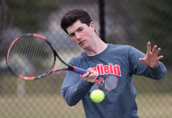 Canfield senior Noah Zoldan gets ready to hit the ball during a match against Howland at Canfield High School on Thursday. EMILY MATTHEWS | THE VINDICATOR