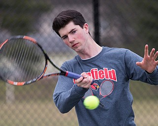Canfield senior Noah Zoldan gets ready to hit the ball during a match against Howland at Canfield High School on Thursday. EMILY MATTHEWS | THE VINDICATOR