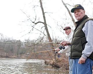 Brothers Jerry, right, and Karl Roach, both of Boardman, fish for rainbow trout after they were released into Lake Glacier on Thursday. EMILY MATTHEWS | THE VINDICATOR