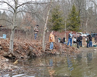 People fish for rainbow trout after they were released into Lake Glacier on Thursday. EMILY MATTHEWS | THE VINDICATOR