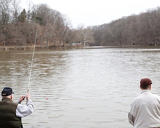 Brothers Jerry, left, and Karl Roach, both of Boardman, fish for rainbow trout after they were released into Lake Glacier on Thursday. EMILY MATTHEWS | THE VINDICATOR