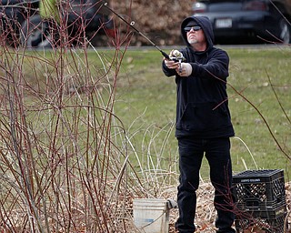 Ron Estep, of Youngstown, fishes for rainbow trout after they were released into Lake Glacier on Thursday. EMILY MATTHEWS | THE VINDICATOR