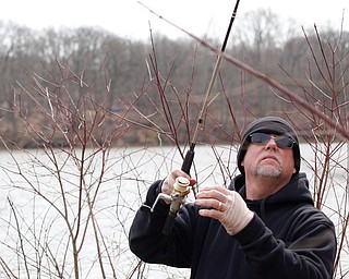 Ron Estep, of Youngstown, fishes for rainbow trout after they were released into Lake Glacier on Thursday. EMILY MATTHEWS | THE VINDICATOR