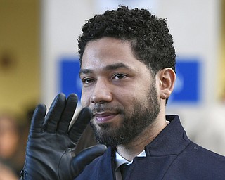 Actor Jussie Smollett smiles and waves to supporters before leaving Cook County Court after his charges were dropped in Chicago. A deadline is looming for Smollett to pay over $130,000 to Chicago to cover part of the costs of an investigation into his report of a racist, anti-gay attack or risk getting slapped with a civil lawsuit. Thursday is seven days since Mayor Rahm Emanuel's law department sent the "Empire" a March 28 letter demanding he writes them a money order or cashier's check for $130,106, plus 15 cents. It said he had seven days.