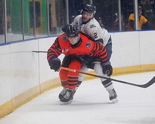 Phantoms' Trevor Kuntar and Stampede's Matt Kessel go after the puck during their game on Friday night. EMILY MATTHEWS | THE VINDICATOR