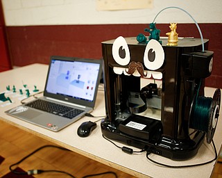 A 3-D printer students use to make toy figurines is displayed during STEAM night at Glenwood Junior High School on Friday night. EMILY MATTHEWS | THE VINDICATOR