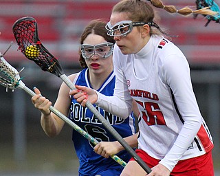 William D. Lewis The vindicator  Canfield's Tara Santaro(36) moves the ball past Poland's Emille Franco(6) during 4-5-19 game with Poland.