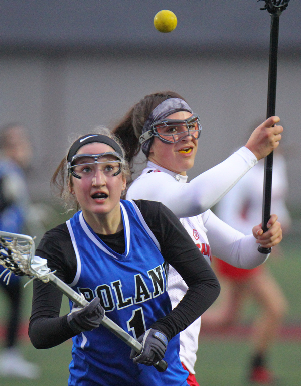 William D. Lewis The vindicatorPoland's Addison Kaschak(1) and Canfield's Athena Poullas(37) go for the ball during 4-5-19 game.