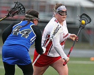 William D. Lewis The vindicator  Canfield's Shiane Donnarummo(43) moves the ball past Polnd's Ellie Kempers(44)during 4-5-19 game with Poland.