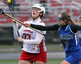 William D. Lewis The vindicator  Canfield's Geena Cianciolla(23) moves the ball around Poland's sarah Leach(7) during 4-5-19 game with Poland.