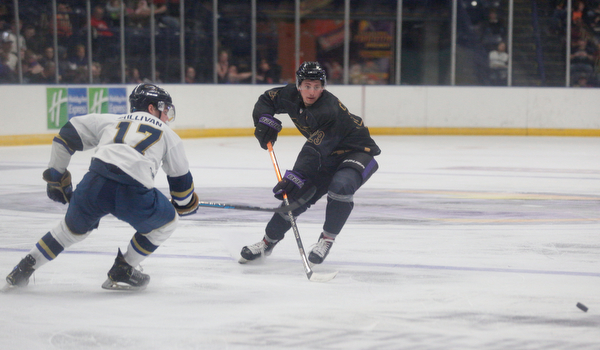 Phantoms' Gianfranco Cassaro and Stampede's Ryan Sullivan go after the puck during the second period of their game Saturday night. EMILY MATTHEWS | THE VINDICATOR