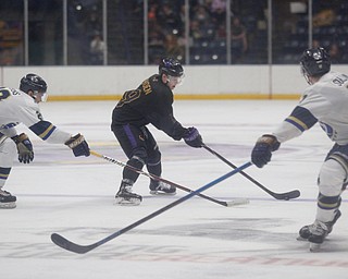 Phantoms' Ben Schoen tries to keep the puck from Stampede's Sam Stevens, left, and Ryan Sullivan during the second period of their game Saturday night. EMILY MATTHEWS | THE VINDICATOR