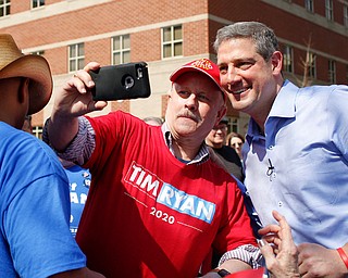 Tim Ryan takes a selfie with Johnny Street, of Vienna, during Ryan's presidential kickoff rally on Federal Street Saturday afternoon. EMILY MATTHEWS | THE VINDICATOR