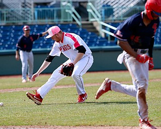  NILES, OHIO - April 6, 2019:  During the 4th inning, Youngstown State Penguins' Travis Perry (33) fields the ground ball off the bat of University of Illinois at Chicago Flames' Derrick Patrick (45) for the 3rd out at Eastwood Field. Photo by MICHAEL G. TAYLOR | THE VINDICATOR