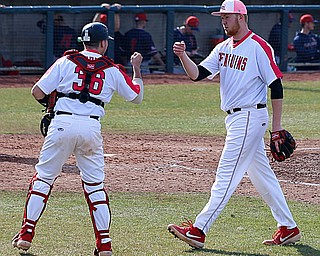  NILES, OHIO - April 6, 2019:  During the 7th inning, Youngstown State Penguins' catcher Dylan Swarmer (36) and pitcher Travis Perry (33) fist pump at Eastwood Field. Photo by MICHAEL G. TAYLOR | THE VINDICATOR