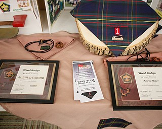 Wood Badges for Albin Dearing, left, and Kevin Miller are displayed on a table at the Whispering Pines Recognition Dinner in St. James Episcopal Church in Boardman on Sunday. EMILY MATTHEWS | THE VINDICATOR