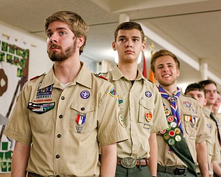 From left, Eagle Scouts Thomas McNally, of troop 25, Philip Hockensmith, of troop 44, and Colin Russell, of troop 60, stand with other Eagle Scouts to be recognized at the Whispering Pines Recognition Dinner in St. James Episcopal Church in Boardman on Sunday. EMILY MATTHEWS | THE VINDICATOR