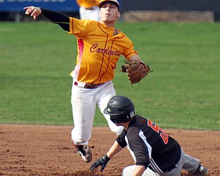 William D. Lewis The Vindicator  Springfield's John Slike(5) is out as Mooney's John Mikos(4) turns a double play during