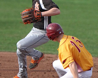 William D. Lewis The Vindicator Mooney's Walter Sweeney(15) is out a 2nd as Springfield's Nick Slike(2) looks to throw to frist.