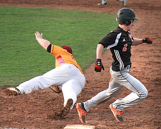 William D. Lewis The Vindicator   Springfield's Shane Eynon(2) is safe at 1rst as Mooney 1rst baseman Colin Rushen(22)tries to make the catch during 4-8-19 action at Cene.