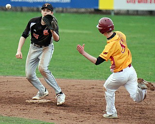 William D. Lewis The Vindicator Mooney's AJ Pepperney(80 is out at 2nd as Springfeild's Drew Clark(22) makes the catch.