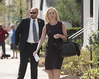 Homeland Security Secretary Kirstjen Nielsen talks outside her home in Alexandria, Va., on Monday, April 8, 2019. Nielsen says she continues to support the president’s goal of securing the border in her first public remarks since her surprise resignation. 