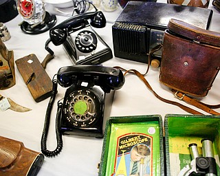 Many antique items, including telephones and microscopes, will be for sale in the antique room at the Angels for Animals garage sale that will be taking place Friday through Sunday at the Canfield Fairgrounds. EMILY MATTHEWS | THE VINDICATOR