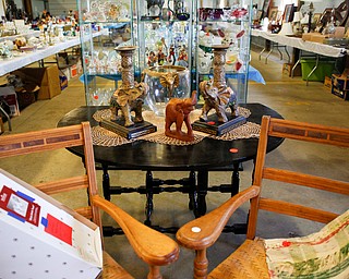 Many antique items, including elephant figurines, quilts, and furniture, will be for sale in the antique room at the Angels for Animals garage sale that will be taking place Friday through Sunday at the Canfield Fairgrounds. EMILY MATTHEWS | THE VINDICATOR