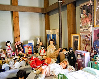 Dolls are among the many items that will be for sale in the antique room at the Angels for Animals garage sale that will be taking place Friday through Sunday at the Canfield Fairgrounds. EMILY MATTHEWS | THE VINDICATOR