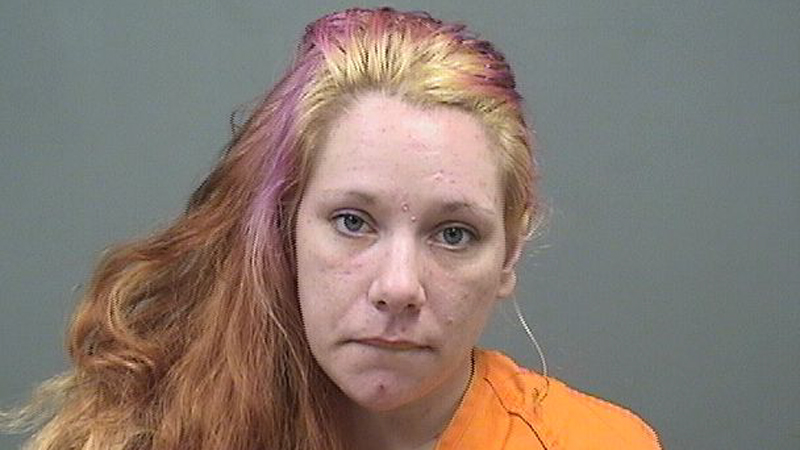 Jonnie Winslow, 31, was arrested on a charge of possession of drugs, a felony. Police and city school employees found her passed out at the city school district's bus garage.

