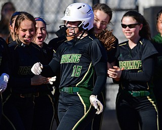 YOUNGSTOWN, OHIO - APRIL 9, 2019: Ursuline's Emily Holland is congratulated by her teammates after hitting a solo home run in the second inning of Tuesday afternoons game at Youngstown State Softball Complex. DAVID DERMER | THE VINDICATOR