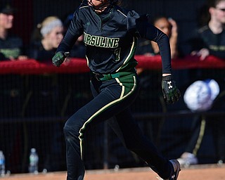 YOUNGSTOWN, OHIO - APRIL 9, 2019: Ursuline's Destiny Goodnight scores a run after a RBI-double by Gia Caldrone in the third inning of Tuesday afternoons game at Youngstown State Softball Complex. DAVID DERMER | THE VINDICATOR