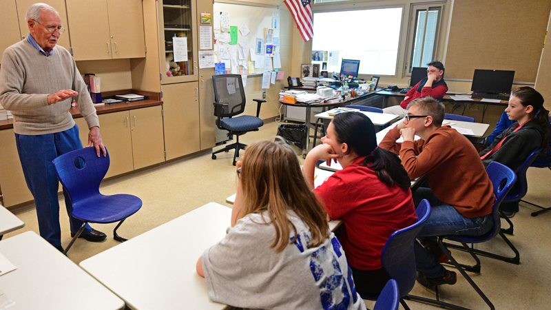 Stephen Kali, a 92-year-old Navy veteran, shares his World War II experiences with Hubbard Middle School students Wednesday. His visit to the school capped the students' lesson on the war.