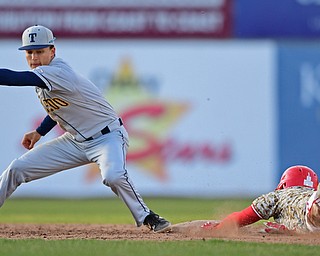 NILES, OHIO - APRIL 10, 2019: Youngstown State's Lucas Nasonti steals second base beating the tag from Toledo's Thomas Eitniear in the seventh inning of Wednesday nights game at Eastwood Field. Youngstown State won 5-3. DAVID DERMER | THE VINDICATOR
