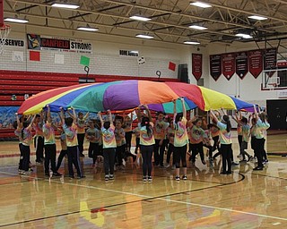 Neighbors | Abby Slanker.C.H. Campbell Elementary School third-grade students performed several tricks with giant parachutes, including running from one side to the other, during the school’s annual Third Grade Physical Education Program on March 6.