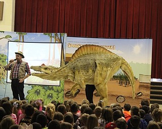 Neighbors | Abby Slanker.Dr. Dino, of the Carnegie Museum of Natural History, introduced Spiny the Spinosaurus to Hilltop Elementary School students during The Spinosaurus Encounter assembly on March 7.