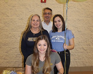 Neighbors | Abby Slanker.Canfield High School senior swimmer Sydney Schuler was joined by her mom, Kelley, her dad, Herb, and her sister, Grace, at a signing ceremony at the high school as she signed her letter of intent to continue her swimming and academic career at John Carroll University on March 15.