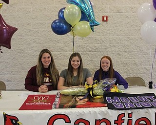 Neighbors | Abby Slanker.Canfield High School celebrated three student athletes who will continue their academic and sports careers at the collegiate level at a signing ceremony on March 15. Pictured are, from left, Kalin Kovach, Walsh University, softball; Sydney Schuler, John Carroll University, swimming and Julia Magliocca, University of Mount Union, cross country and track.