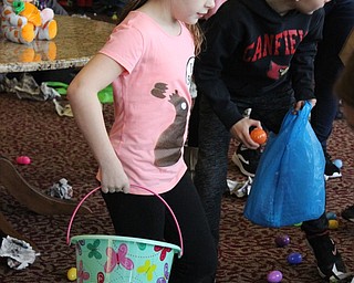 Neighbors | Abby Slanker.Children attending the Canfield Presbyterian Church’s Giant Egg Drop collected several candy filled eggs during the egg hunt on March 30.