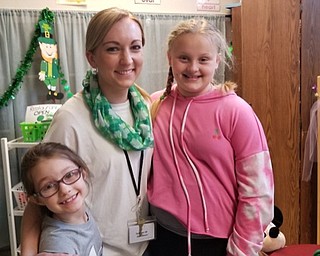 Neighbors | Submitted.Student teacher Amber Wagner posed with students after she visited Joye Bucci's preschool class, assisting students in creating a shamrock craft to donate to a local nursing home.
