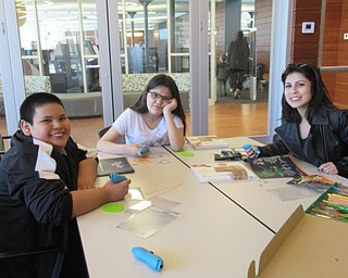 Neighbors | Jessica Harker.Israel Benardino, Valentino McKinley and Natalie Daves gathered at the Michael Kusalabal library April 3 to use 3D pens to create art work.