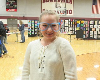 Neighbors | Jessica Harker.Seventh grade student Savanna Watkins created a pair of glasses using 3D pens at the STEAM Night event hosted by Glenwood Junior High School April 5.