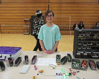 Neighbors | Jessica Harker.Seventh grader Alexa Alabed volunteered to run a table at Boardman Glenwood Junior High School's annual STEAM Night April 5 in the school's gymnasium.