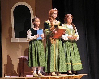 Neighbors | Jessica Harker .Poland High School student Aidan McDanel (center) and two other students from the Poland school district played Fiona throughout the ages in PSHS's Shrek the Musical.